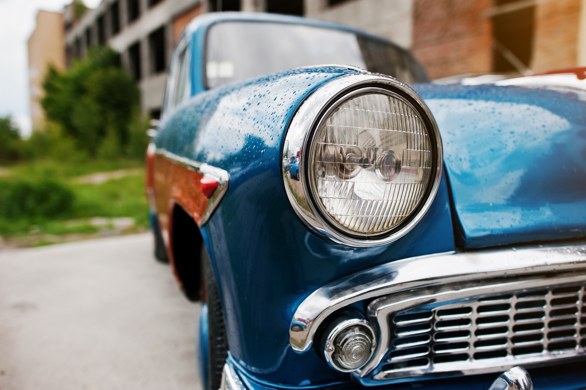 Old vintage car headlight close up.